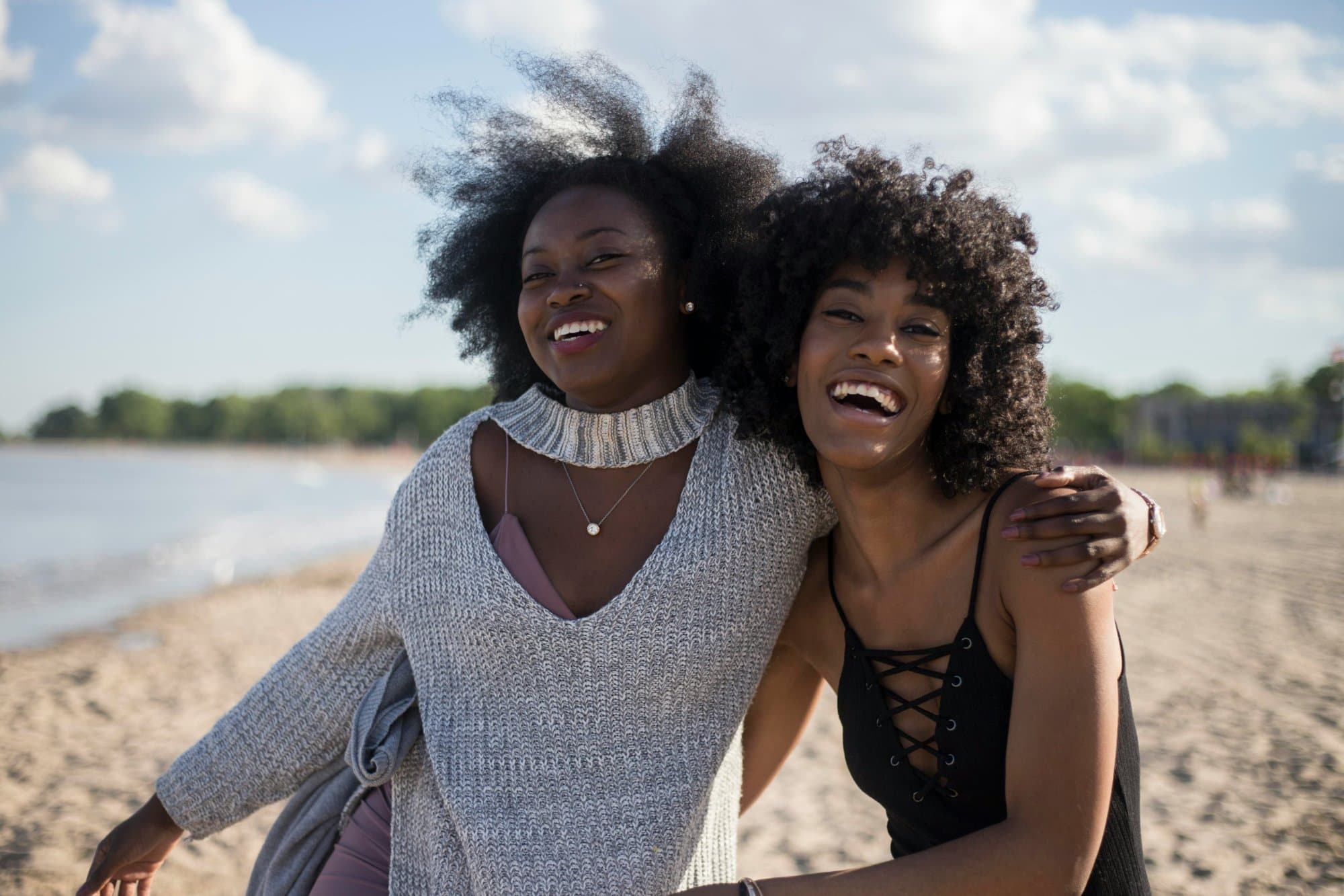 Friends laughing on a beach